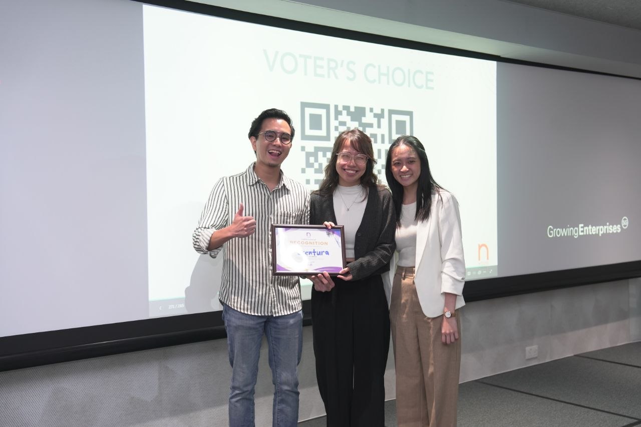Jocelyn and her co-founder Valerie on stage receiving recognition for Scentura